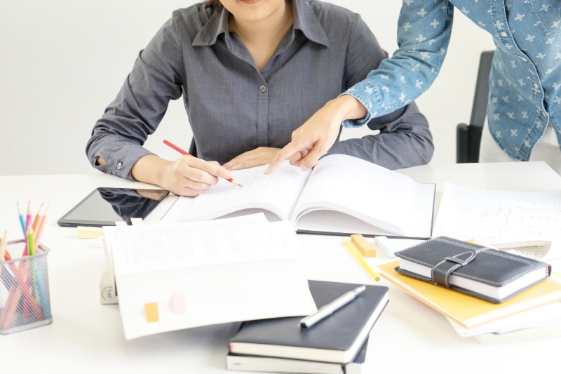 two woman learn and teach tutor out of the class room concept education
